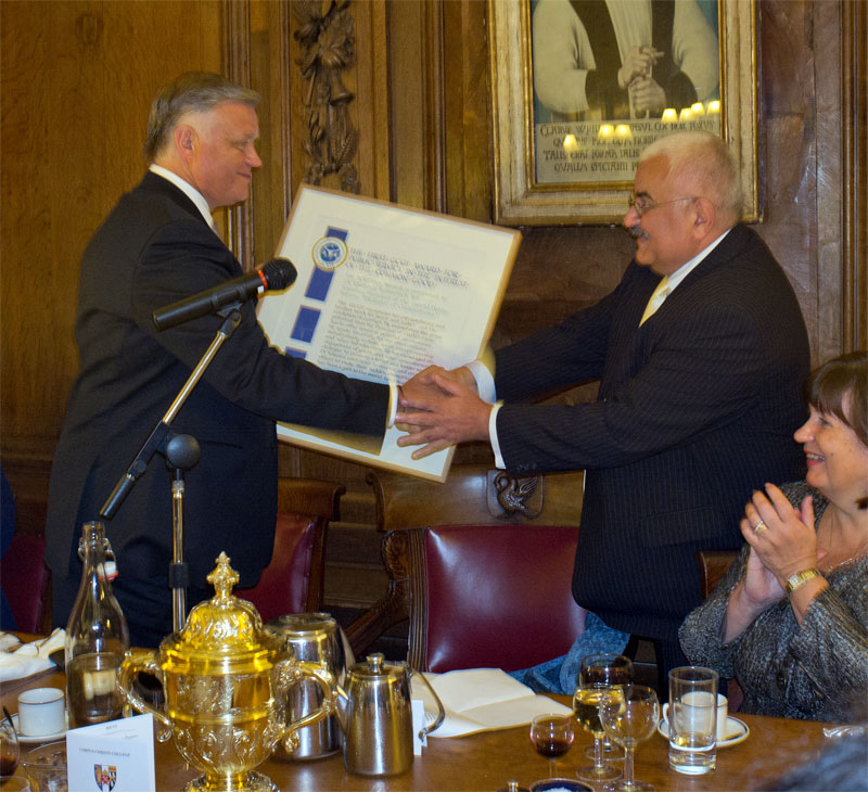 Dr. Vladimir Ivanovich Yakunin (left), Founding President of the World Public Forum receives the award from Dr. Kamran Mofid (right), founder of the GCGI.